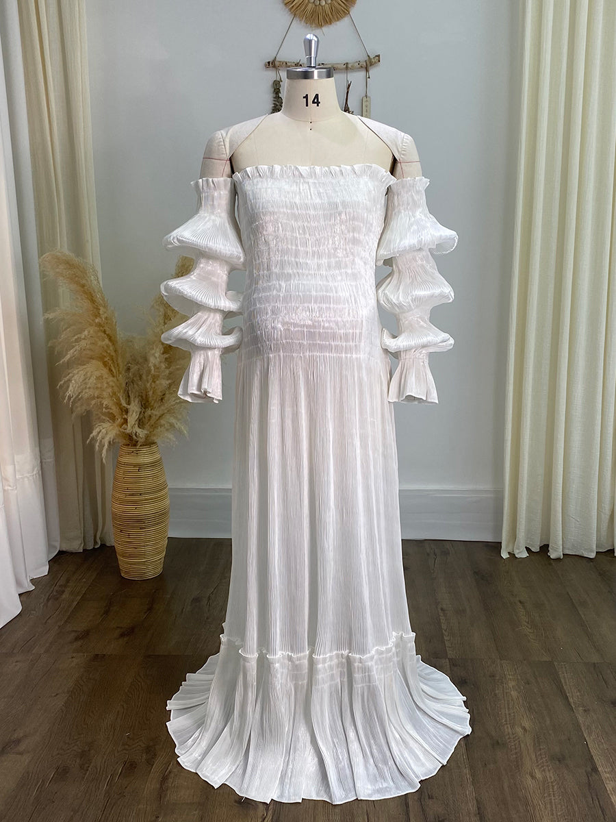 Real product photo of white pleated maternity dress designed for pregnant women and maternity photography