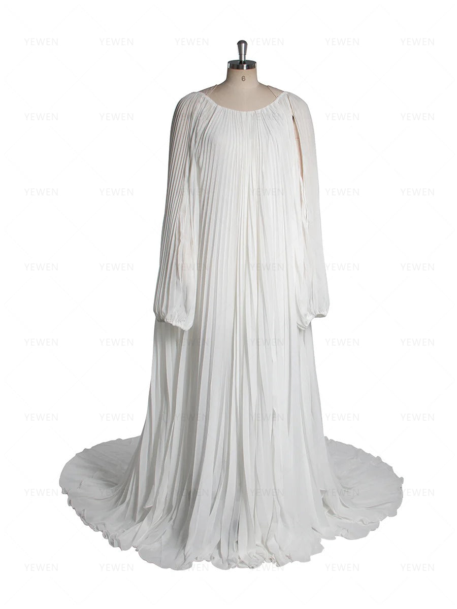 Front view of white pleated blue maternity photoshoot dress featuring off shoulder design and elegant flowing silhouette