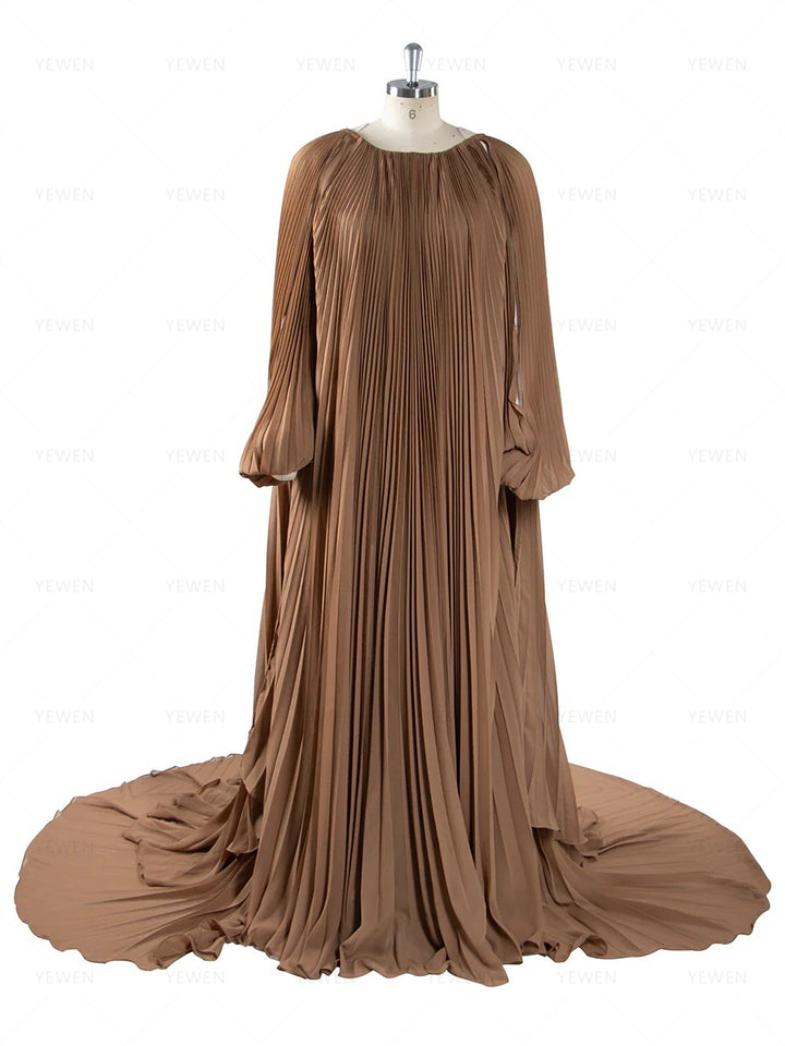 Front view of pleated brown maternity photoshoot dress featuring off shoulder design and elegant flowing silhouette