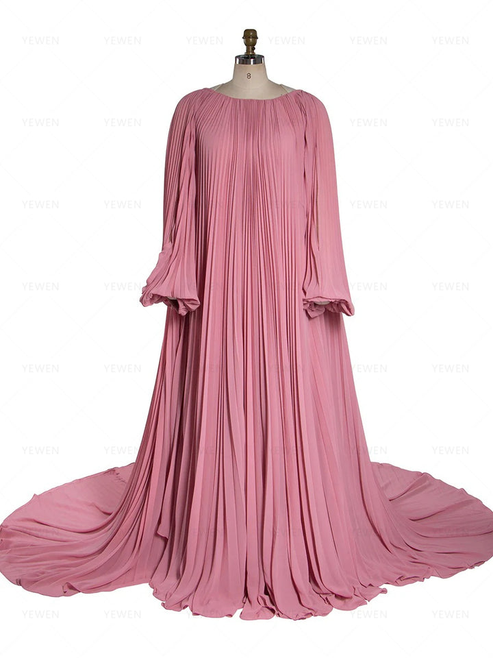Front view of pleated pink maternity photoshoot dress featuring off shoulder design and elegant flowing silhouette