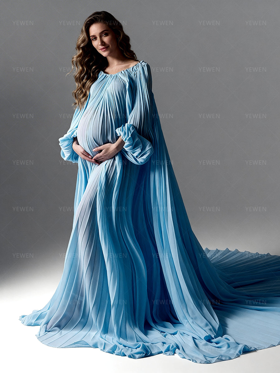 Woman wearing a flowing blue dress against a gray background