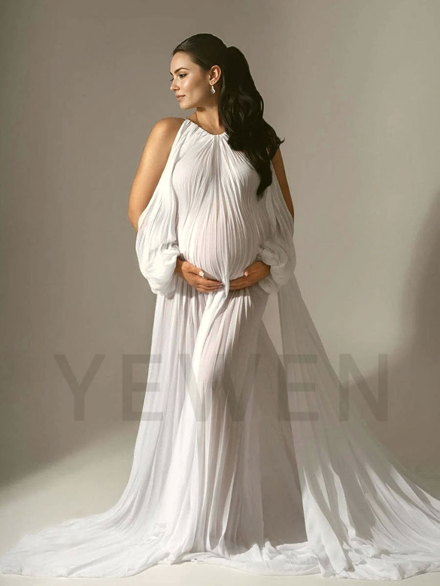 Woman in a flowing white dress standing against a neutral background with 'Yelen' branding.