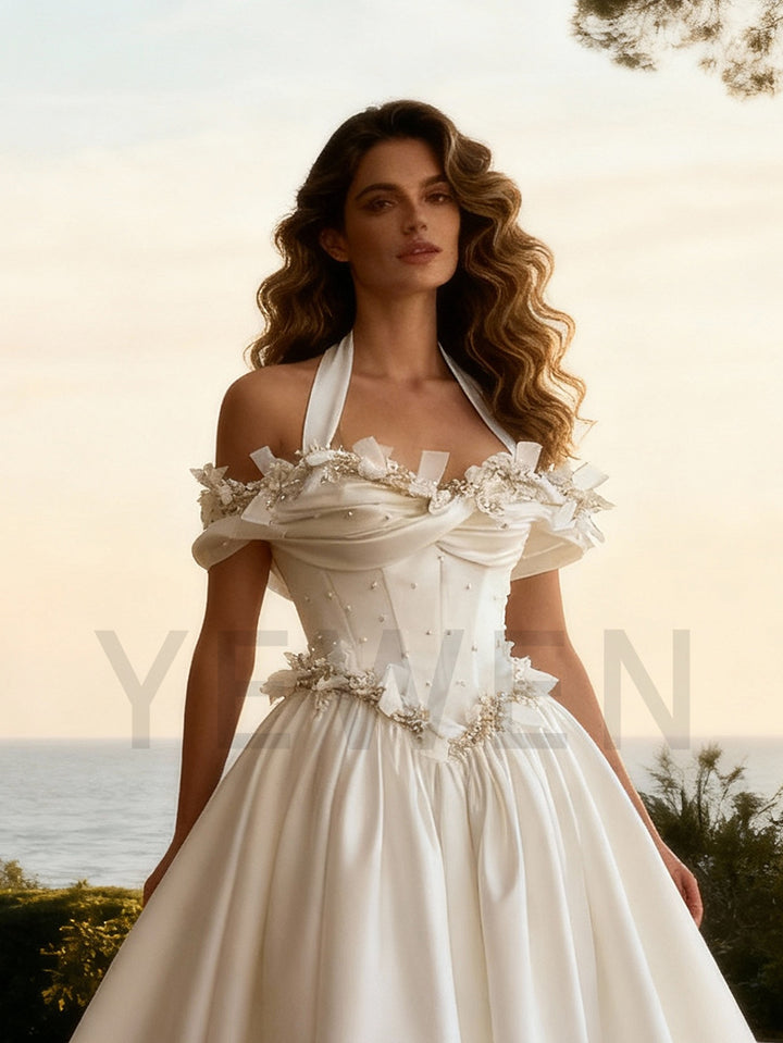 Close-up of 3D flower detailing on princess wedding dress showing luxury craftsmanship and elegant texture
