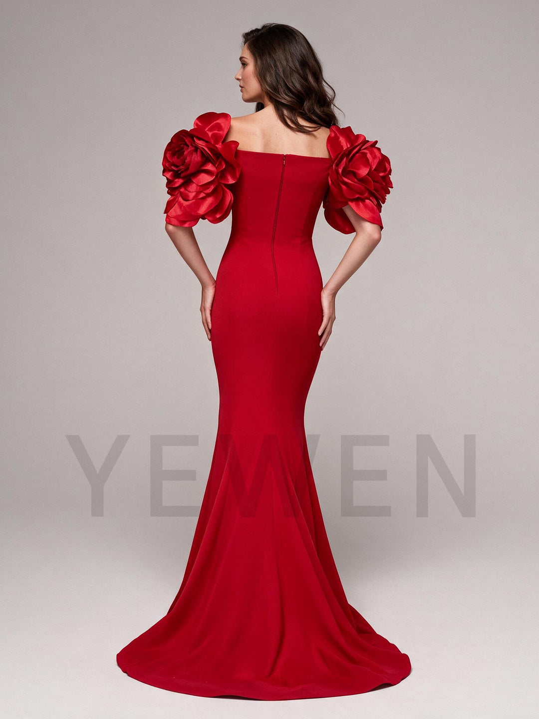 Back view of a red 3D floral mermaid evening gown, showing the fitted silhouette.