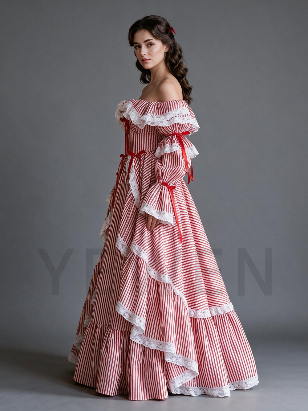 Side profile of a red and white striped princess dress for Christmas with lantern sleeves.