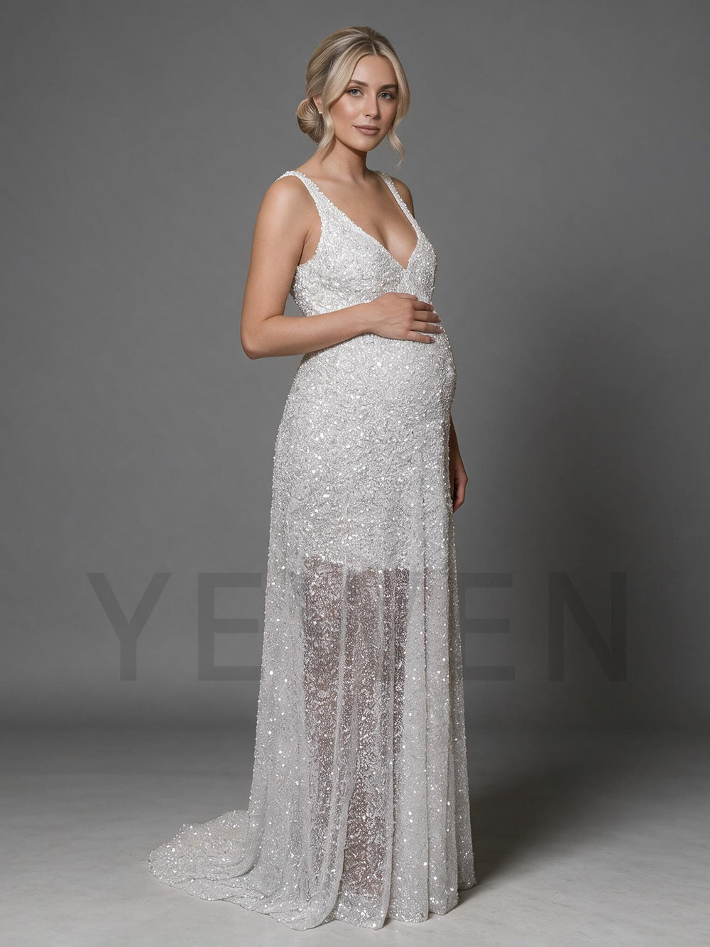 Side profile of a sparkly silver sequin maternity dress with spaghetti straps.
