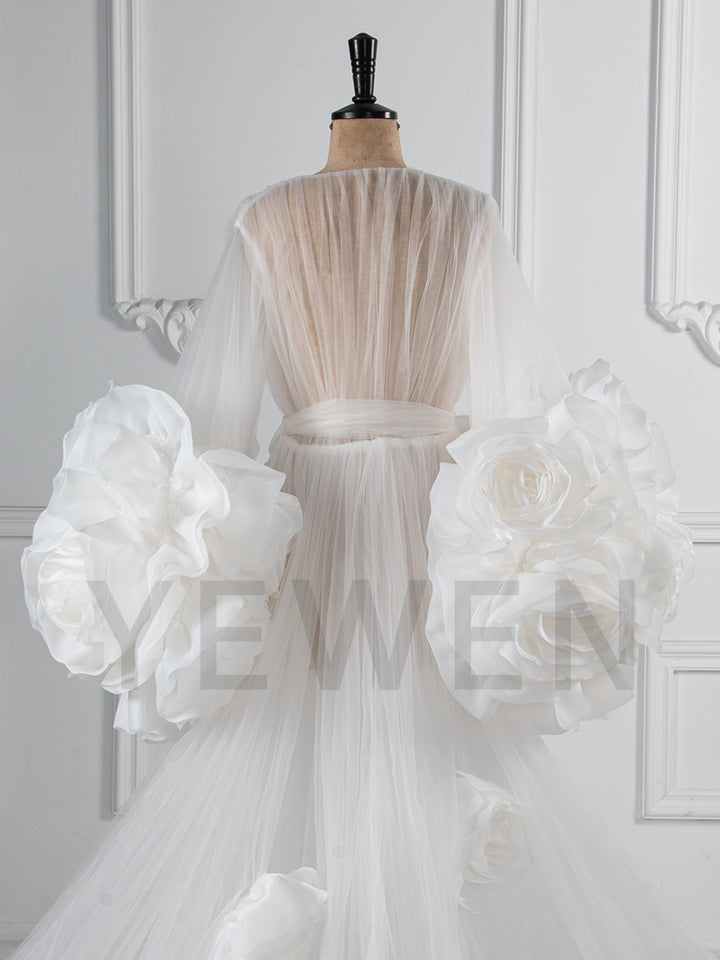 Close-up of 3D rose floral detailing on sheer tulle special occasion dress showing luxury craftsmanship