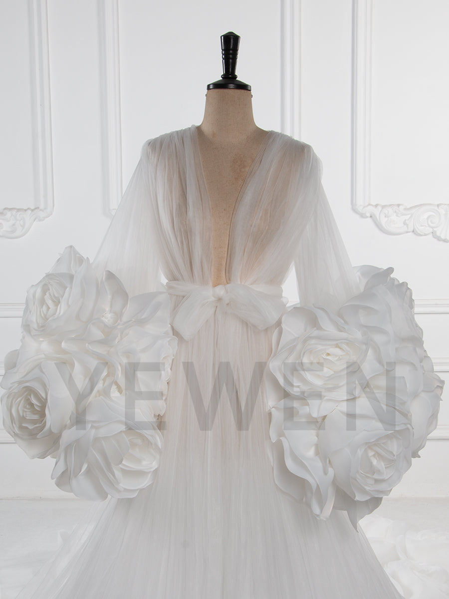 Close-up of 3D rose floral detailing on sheer tulle special occasion dress showing luxury craftsmanship