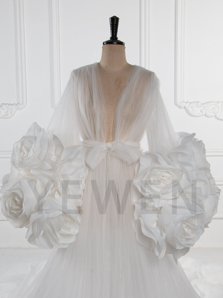 Close-up of 3D rose floral detailing on sheer tulle special occasion dress showing luxury craftsmanship