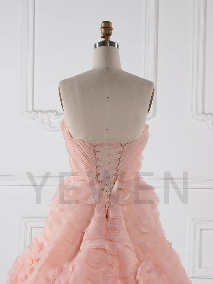 Back view of luxury strapless tiered flower evening dress designed for birthday party and formal evening occasions