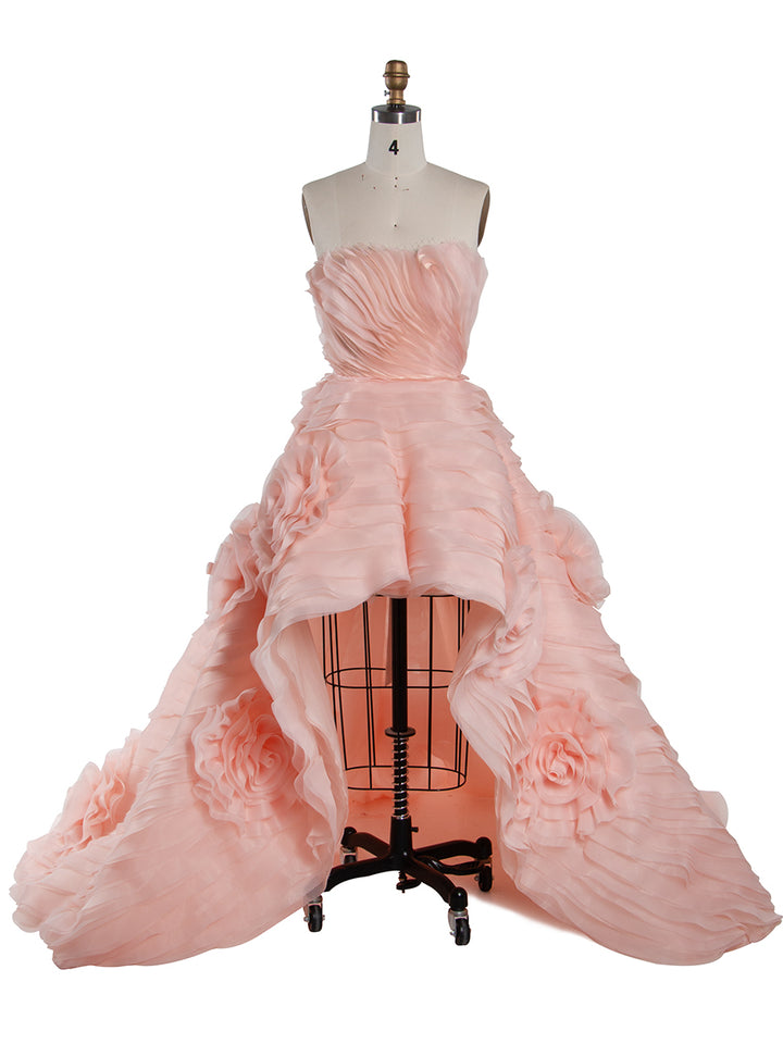 Front view of strapless tiered flower evening dress featuring layered floral design and elegant formal silhouette