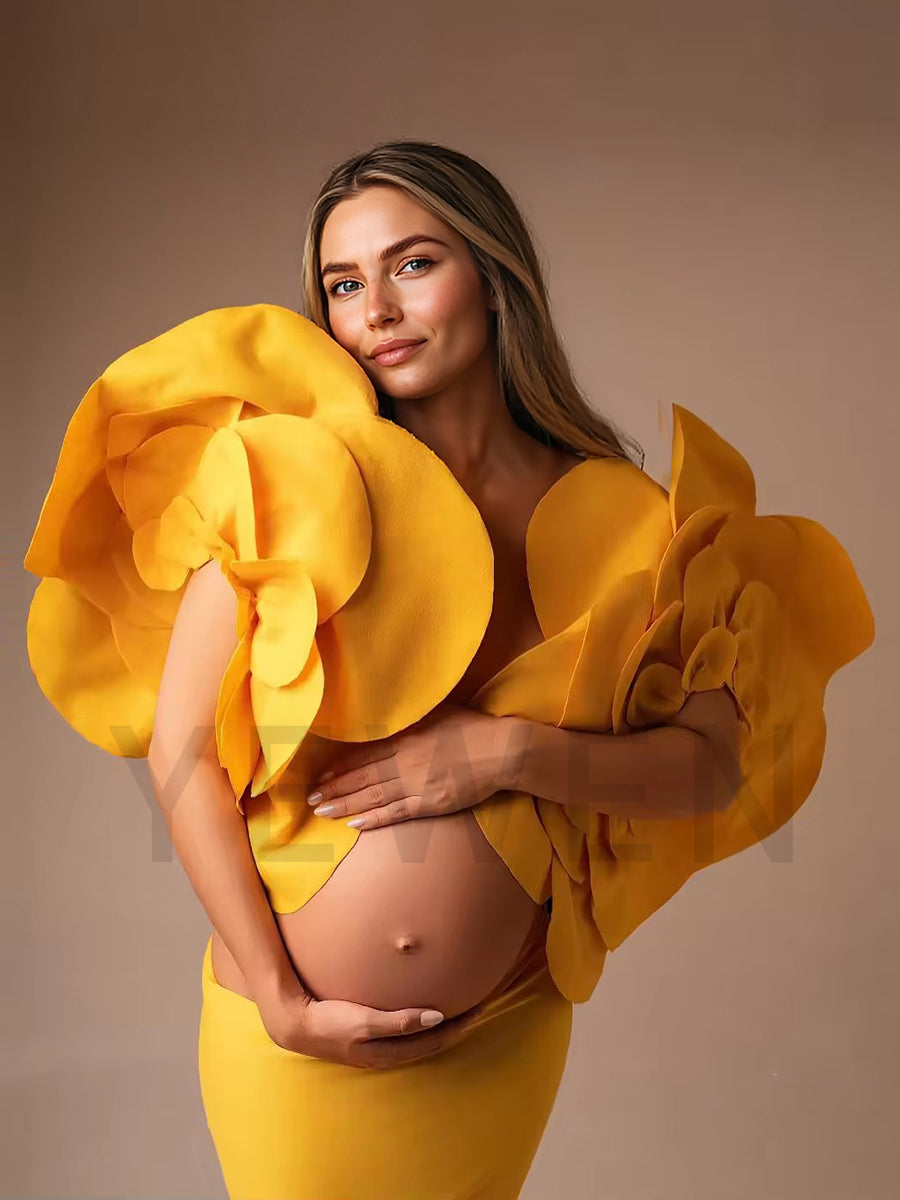 Elegant stretchy maternity dress for photoshoot styled in soft light with romantic floral sleeve design