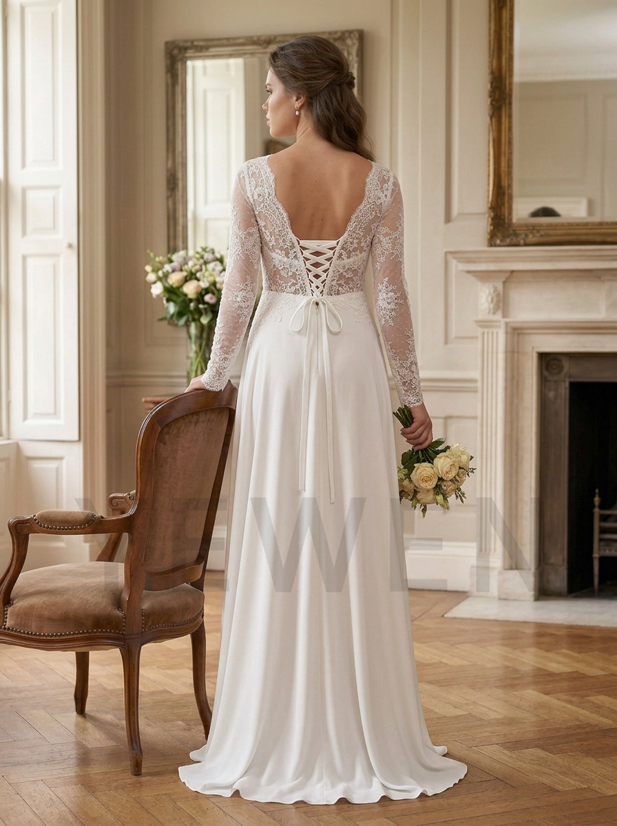 A woman stands in a bright room wearing a long white wedding dress from the back, showing a lace lace-up open back and sheer long sleeves. She holds a bouquet of flowers beside a wooden chair and fireplace.