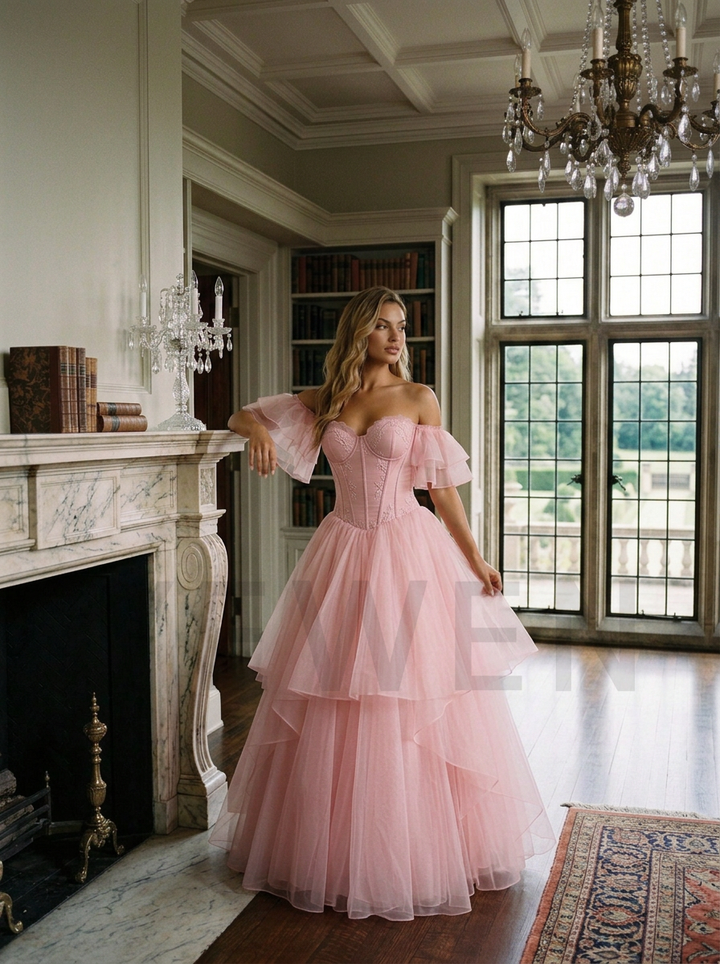 A woman wearing a voluminous light pink off-the-shoulder ball gown stands in a grand, elegant room with a fireplace, bookshelves, and large windows.