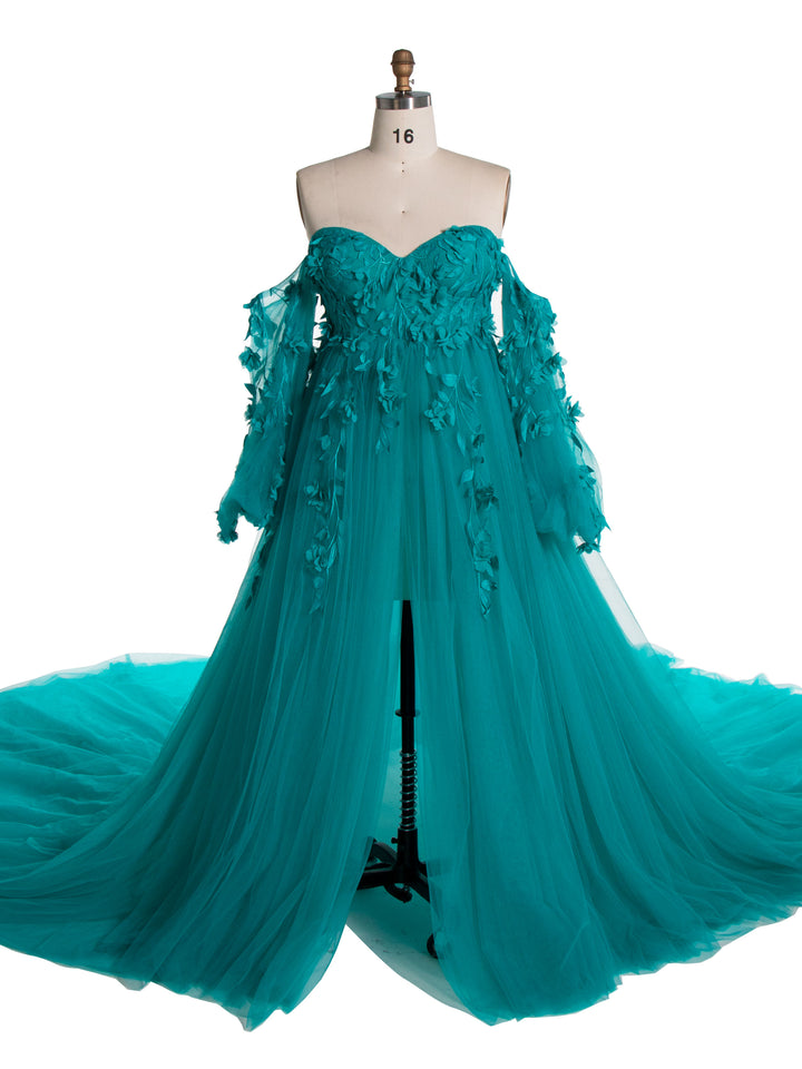 Full body view of green tulle maternity photoshoot dress with long sleeves and floral lace design for elegant photography