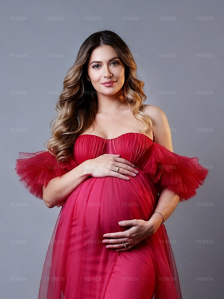 Pregnant woman wearing tulle maternity photoshoot dresses in studio baby belly shooting and pregnancy photography setting