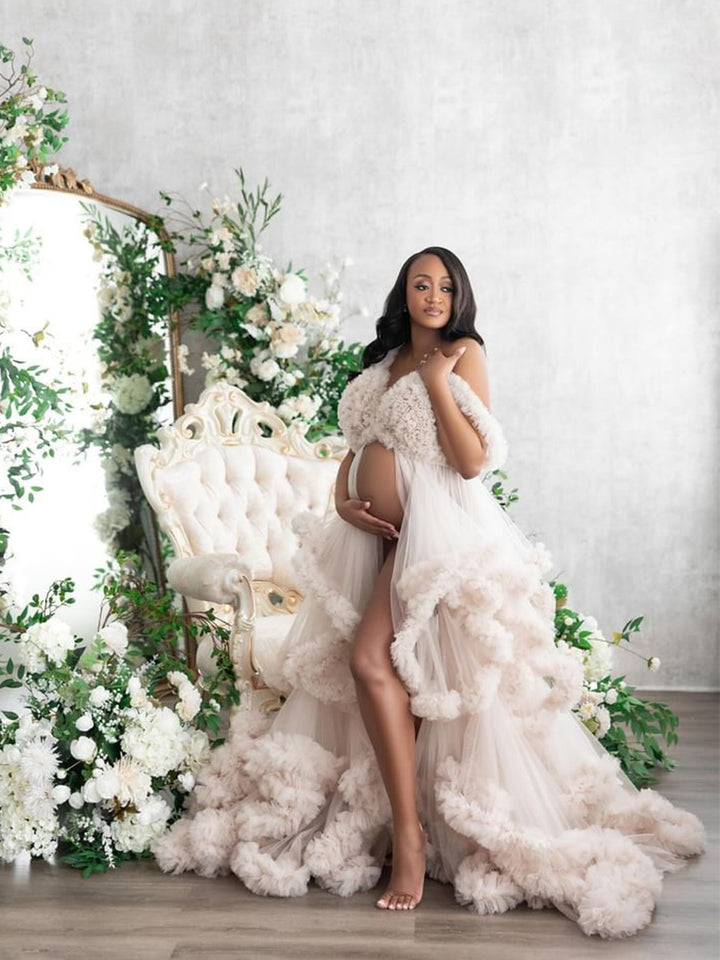 Flowing tulle photoshoot dress with cloud ruffles captured in motion during pregnancy photography