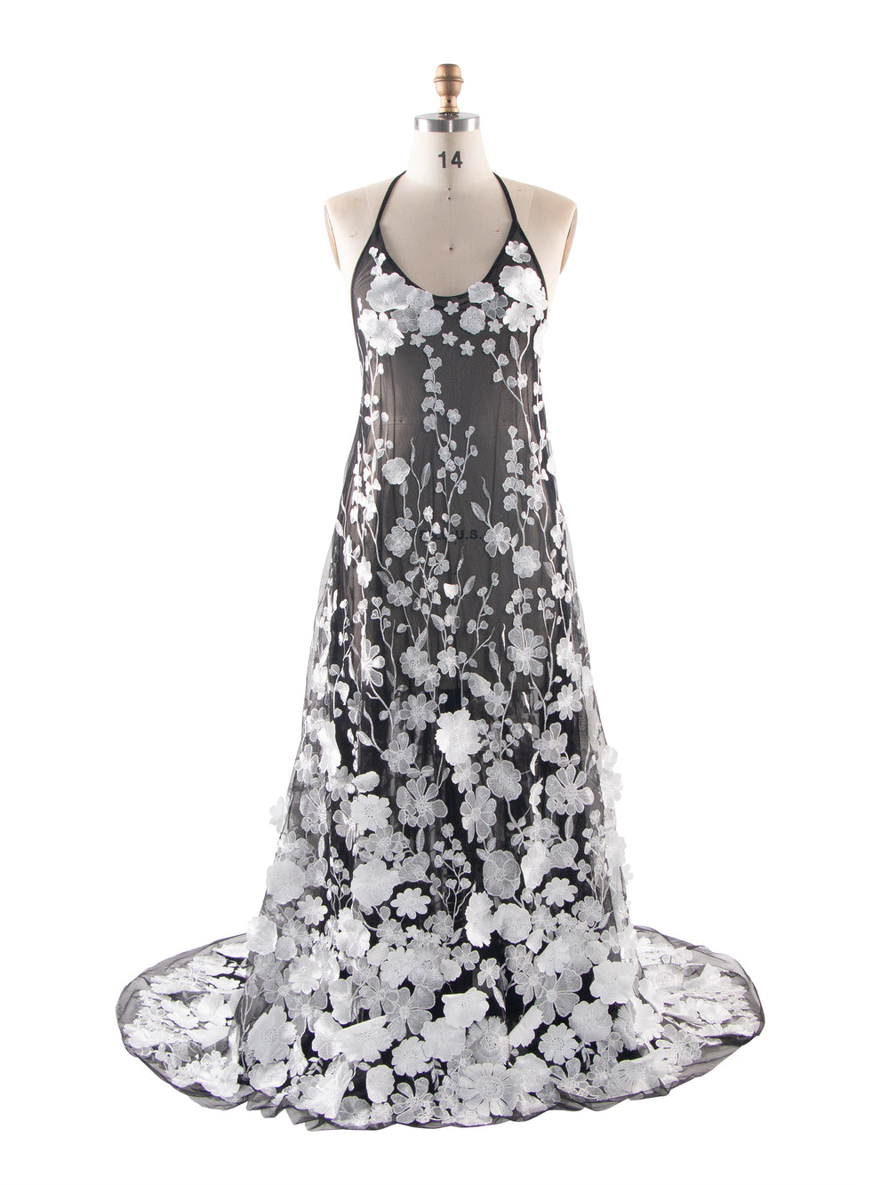 Front view of a white floral lace maternity photoshoot dress shown on a tailor's mannequin.