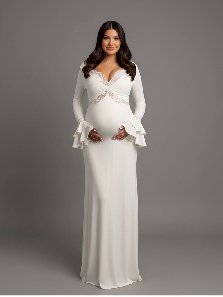Full front view of a pregnant model wearing a white maternity baby shower dress with a deep V-neckline and bell sleeves.