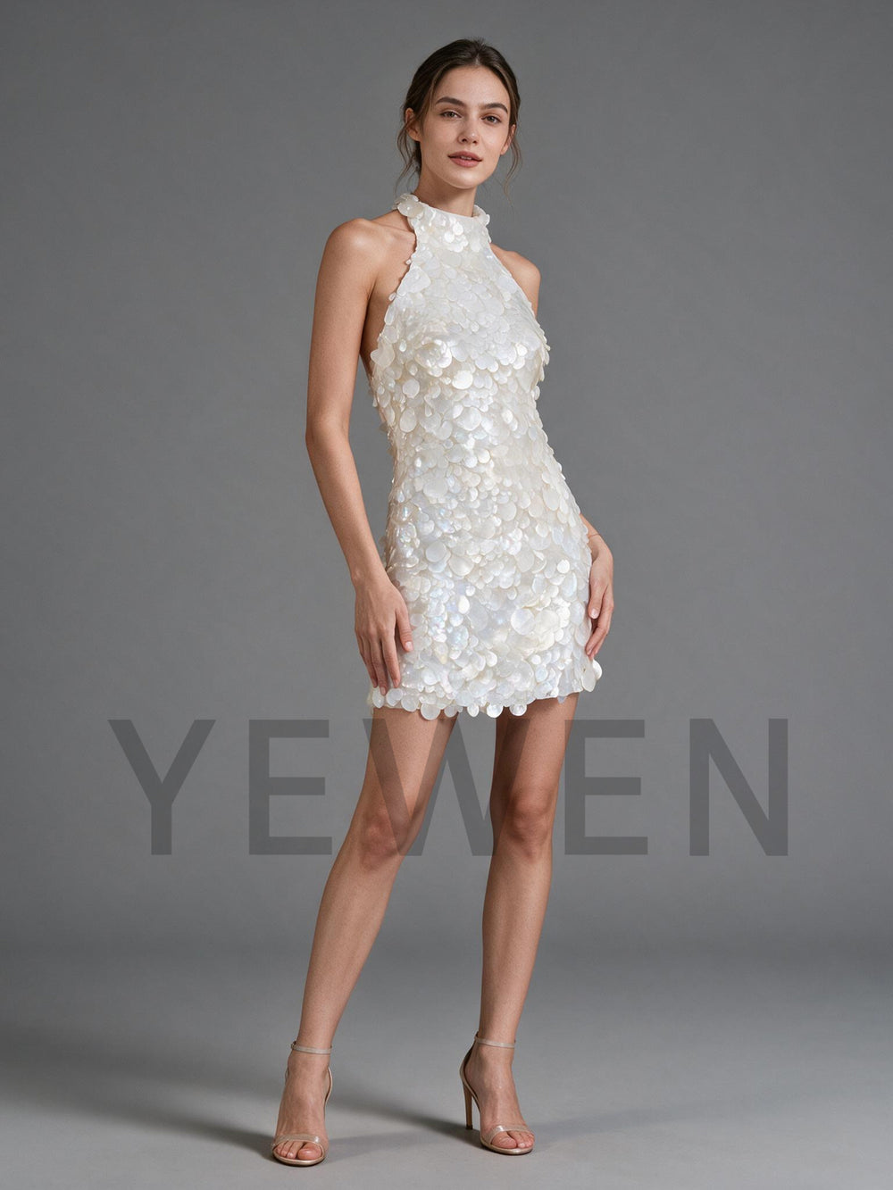 Side view of a fitted sequin halter party dress, showing the body-hugging silhouette.