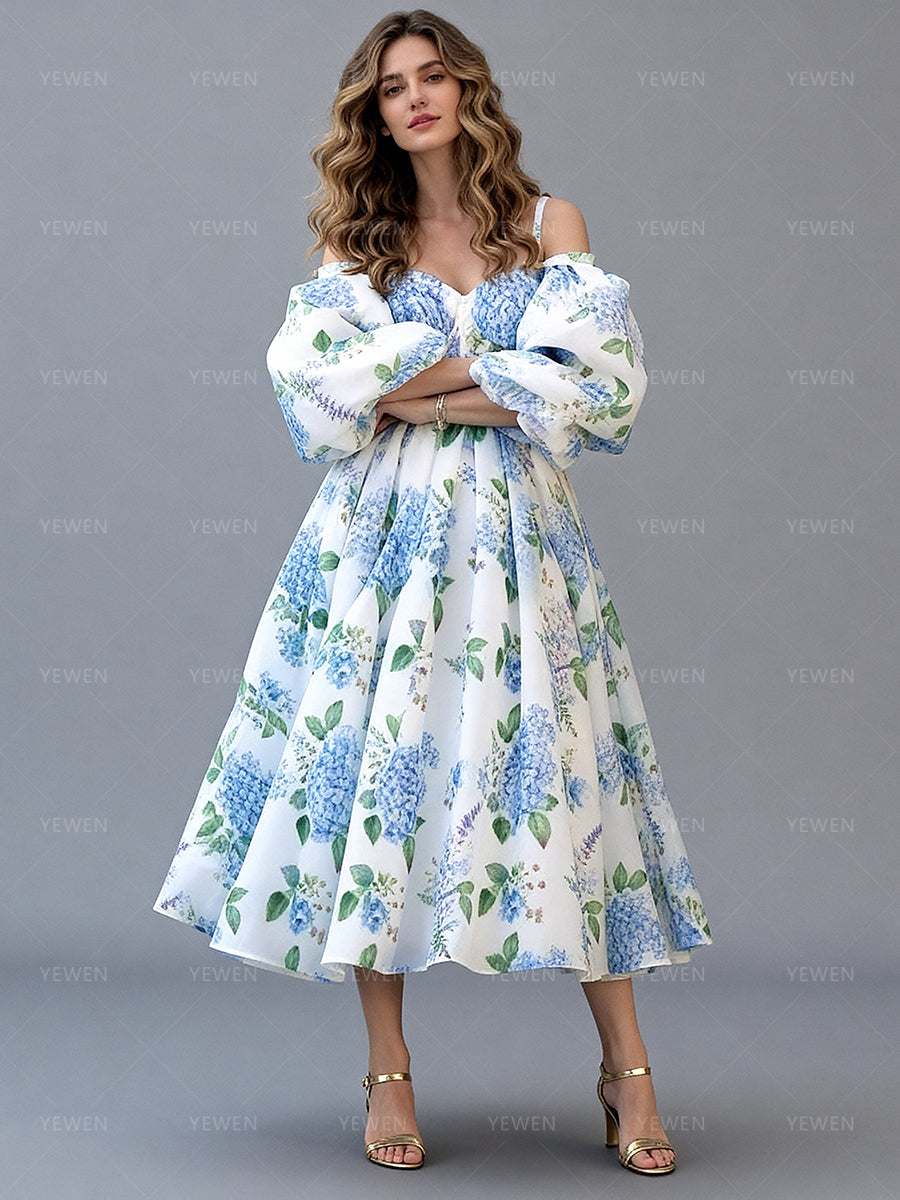 Full front view of a model wearing a blue floral off-shoulder midi party dress with puff sleeves and a pleated A-line skirt.