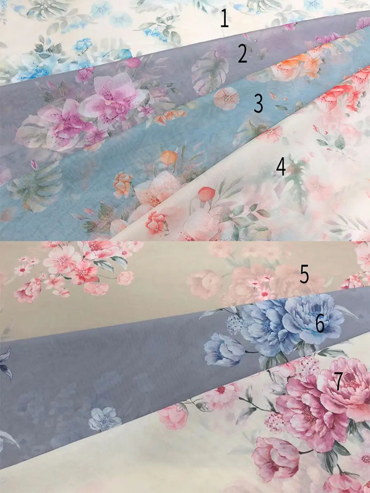 Fabric swatch chart showing 7 different floral pattern and color options available for customization of this off-shoulder gown.