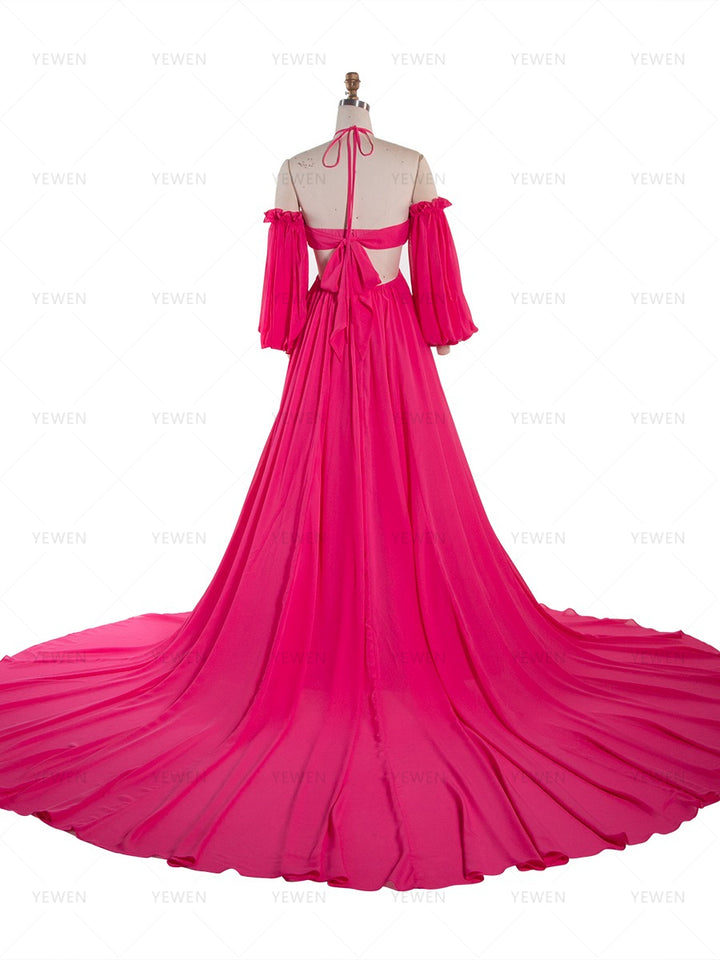 Back full-length view of a hot pink chiffon boho photoshoot dress with a halter neckline detachable puff sleeves a twisted waist and a side slit displayed on a mannequin.
