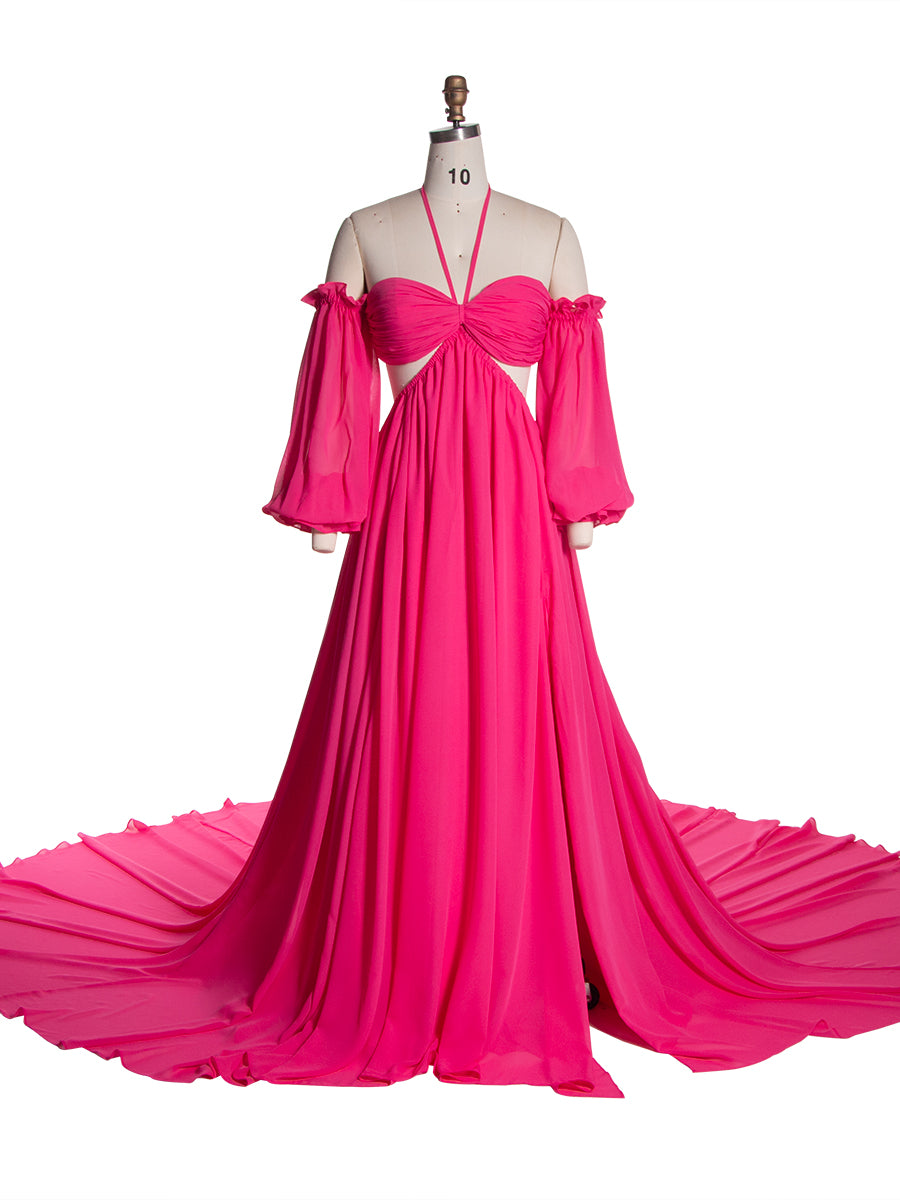 Front view of a hot pink chiffon boho photoshoot dress with a halter neckline detachable puff sleeves a twisted waist and a side slit displayed on a mannequin.