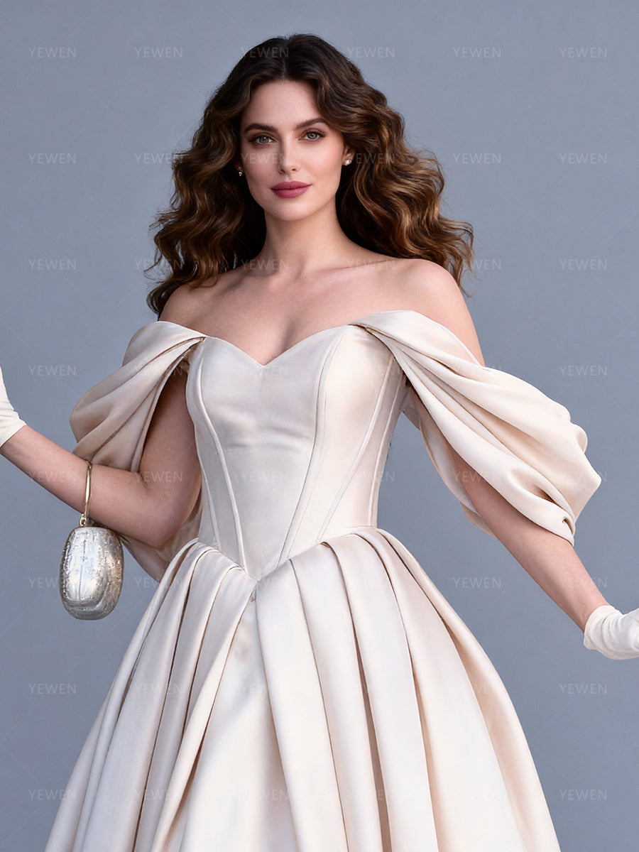 Close-up front view of a model wearing an off-shoulder satin bespoke occasion gown highlighting the corset bodice and sweetheart neckline.