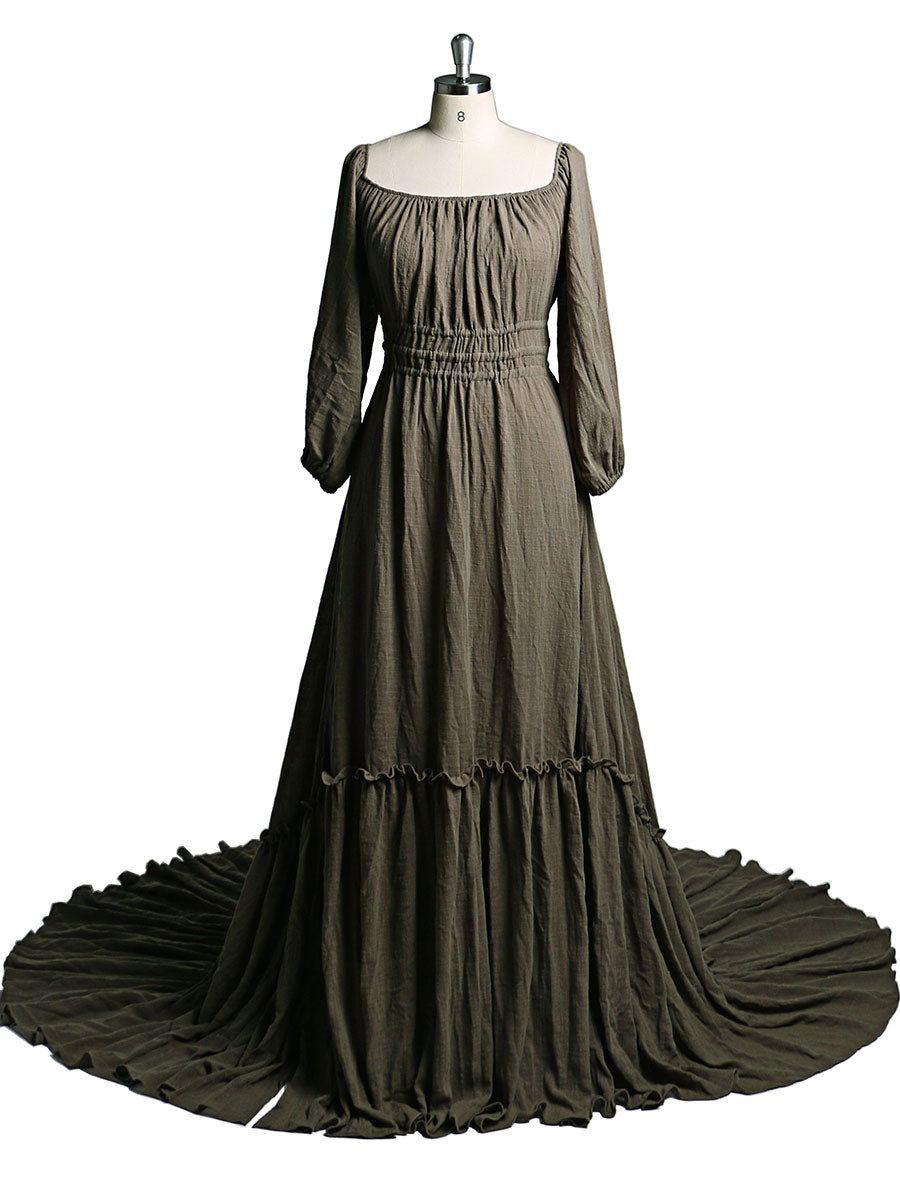 Side view of brown boho maternity photoshoot dress showing full sleeves and flowing bohemian silhouette