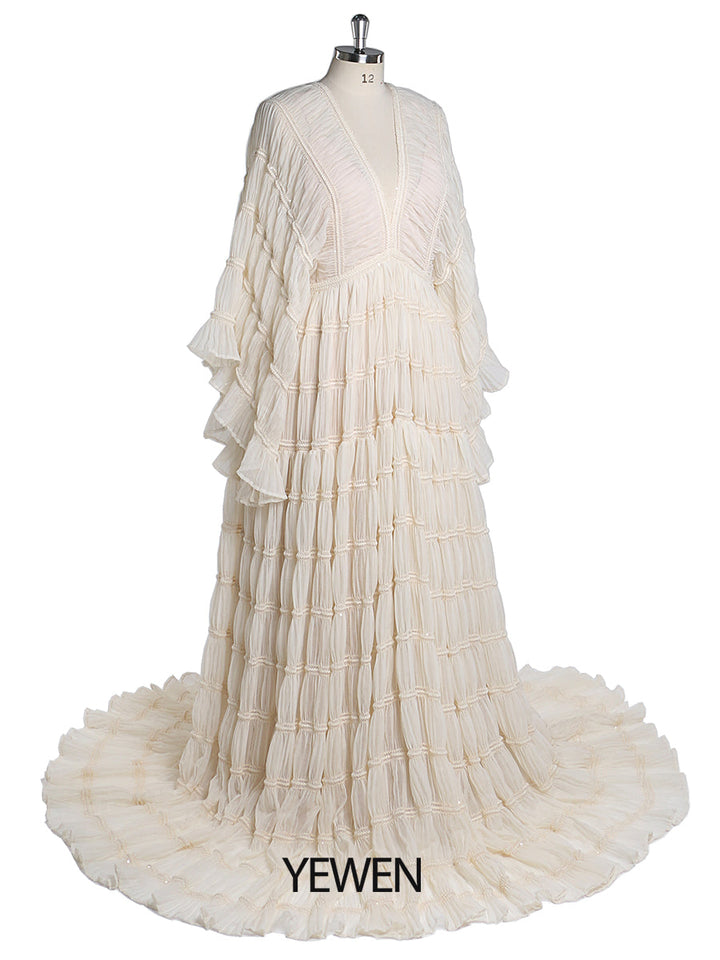 Side view of boho maternity photoshoot dress showing soft slip fabric and bohemian flowing design