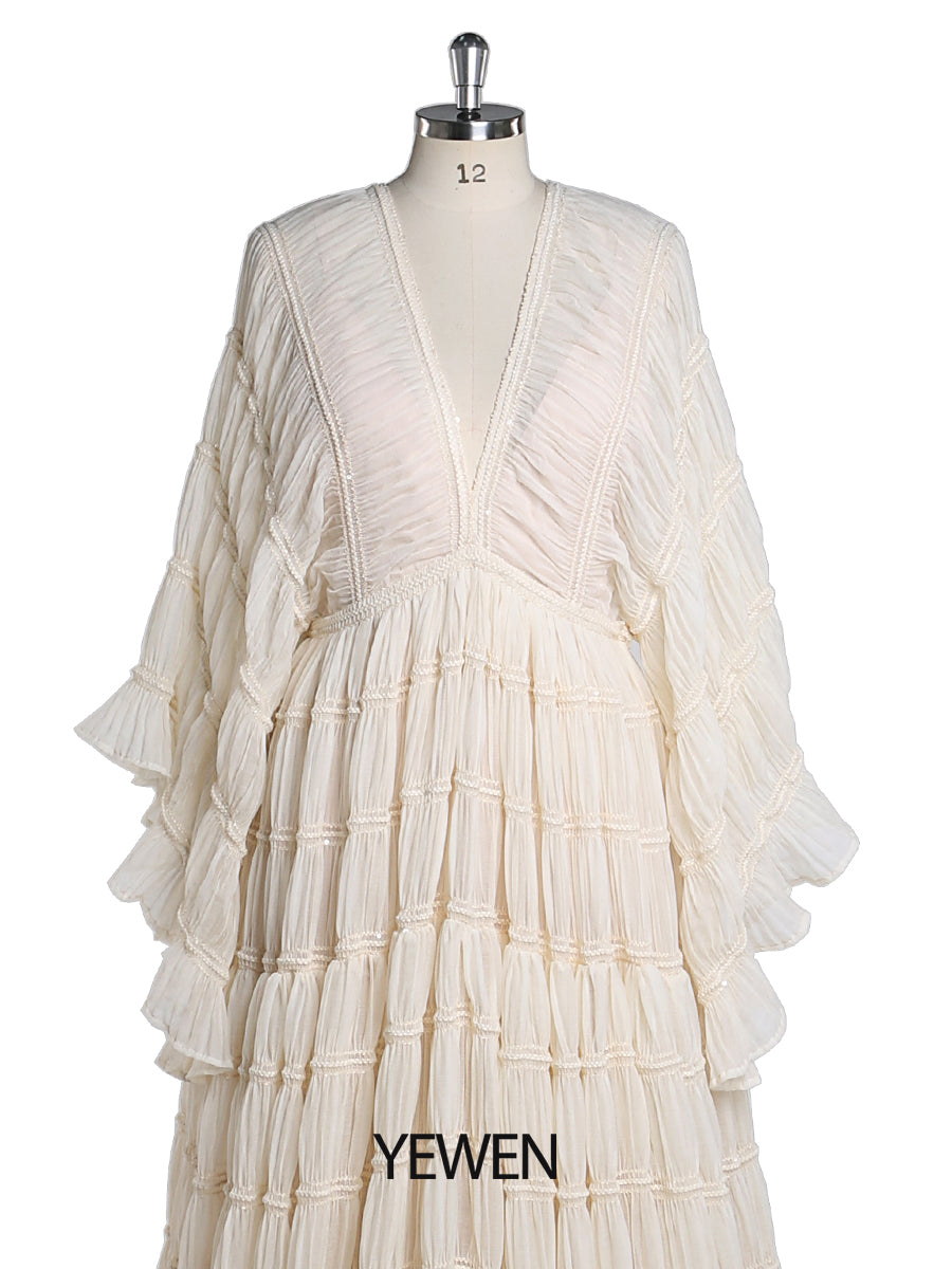 Close-up of soft slip fabric detail on boho maternity photoshoot dress showing bohemian texture