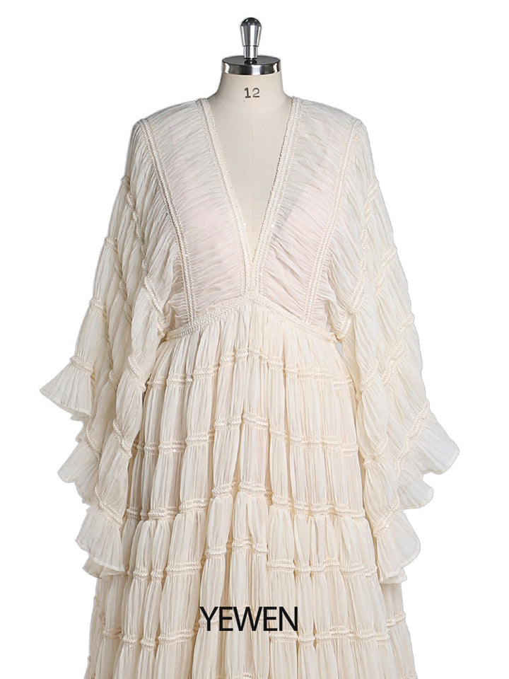 Close-up of soft slip fabric detail on boho maternity photoshoot dress showing bohemian texture