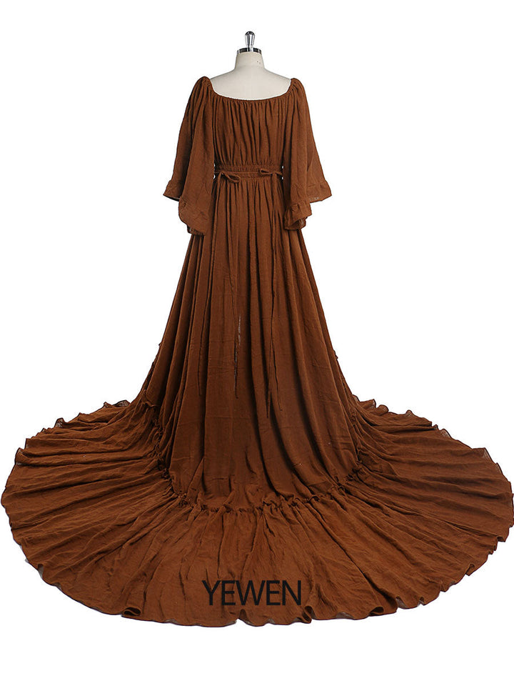 Back view of brown boho photoshoot dress with flare sleeves designed for elegant maternity photography