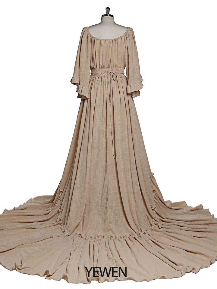 Back view of boho kahaki photoshoot dress with flare sleeves designed for elegant maternity photography