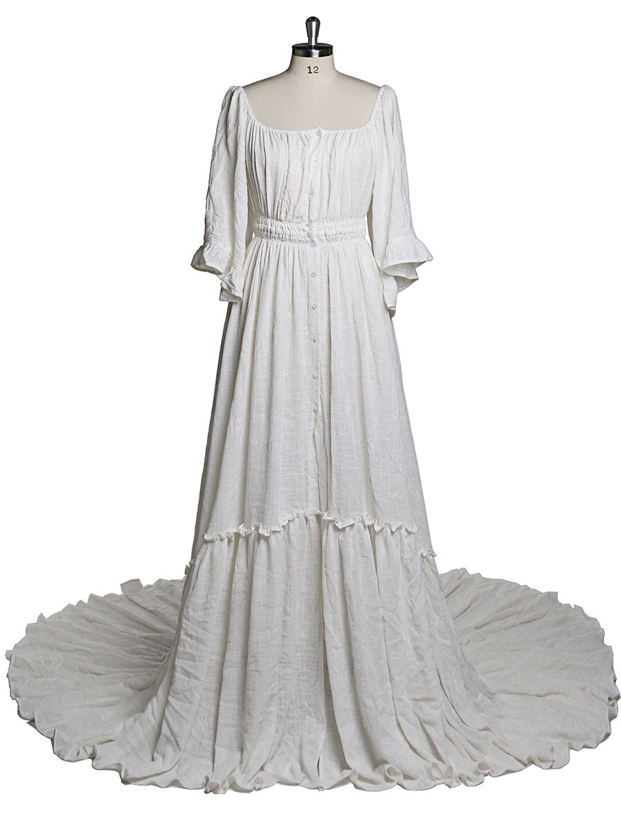 Back view of boho white photoshoot dress with flare sleeves designed for elegant maternity photography