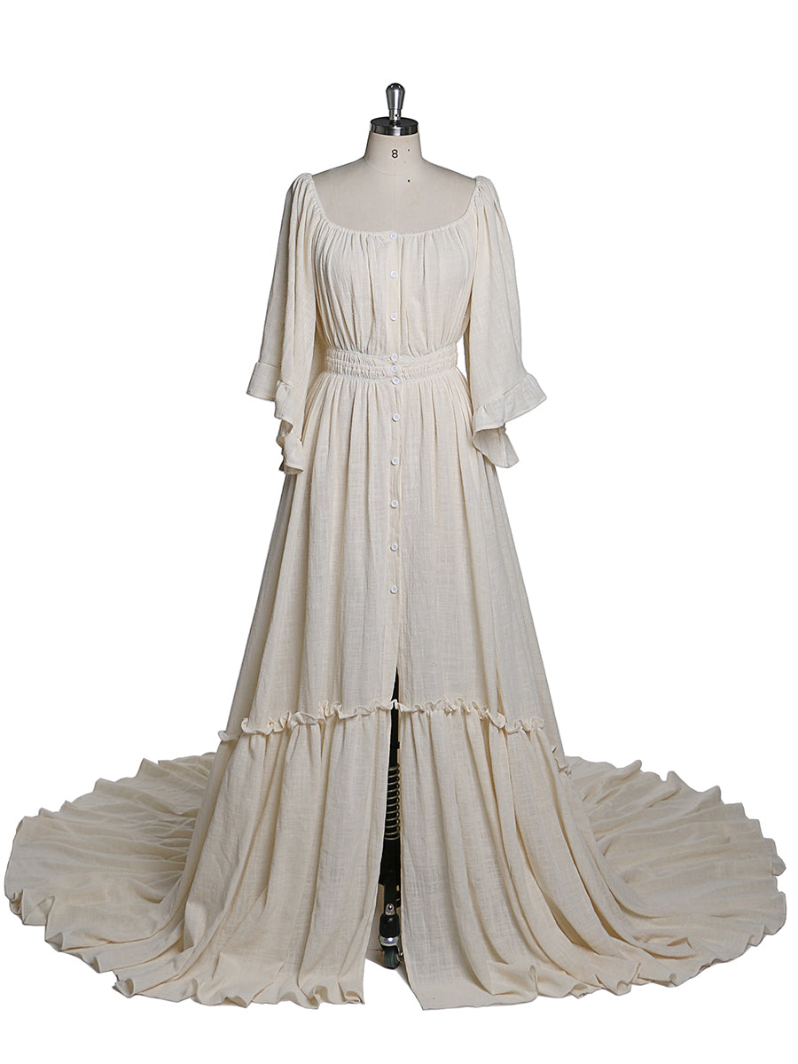 Front view of boho photoshoot dress with flare sleeves and elegant flowing maternity silhouette