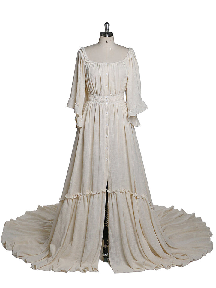 Front view of boho photoshoot dress with flare sleeves and elegant flowing maternity silhouette