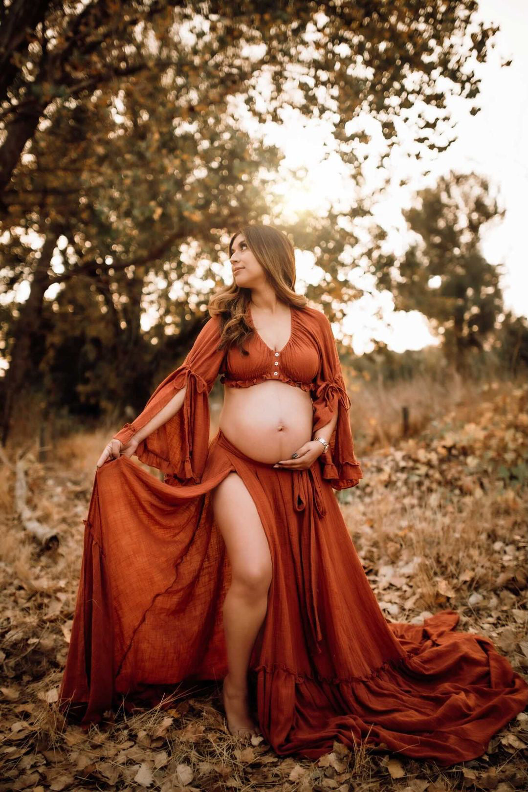 Elegant boho photoshoot dress styled in soft natural light for maternity and baby shower photography