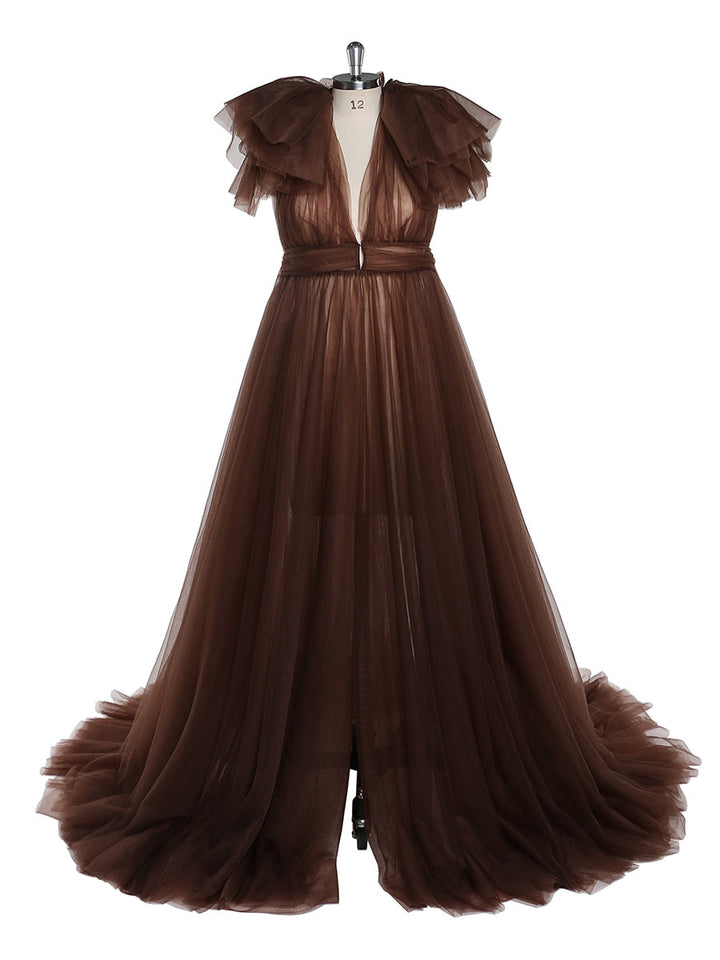 Front view of brown maternity dress for photo shoot featuring tulle flowers and flowing maxi design