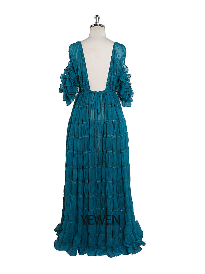 Back view of blue chiffon dress for photo shoot with adjustable shoulder and elegant flowing design