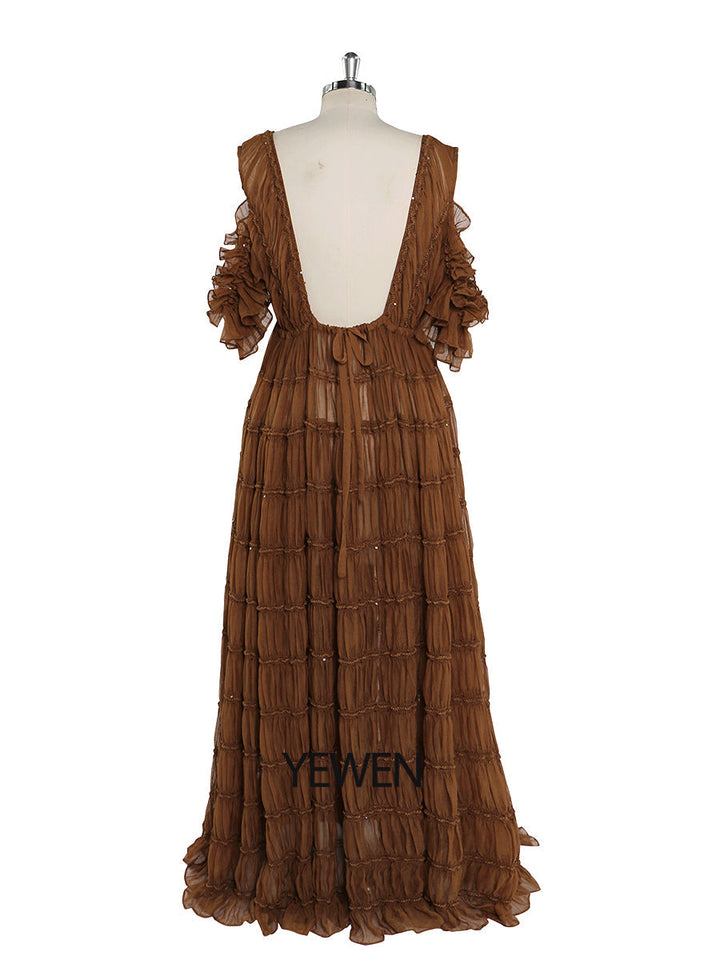 Back view of brown chiffon dress for photo shoot with adjustable shoulder and elegant flowing design