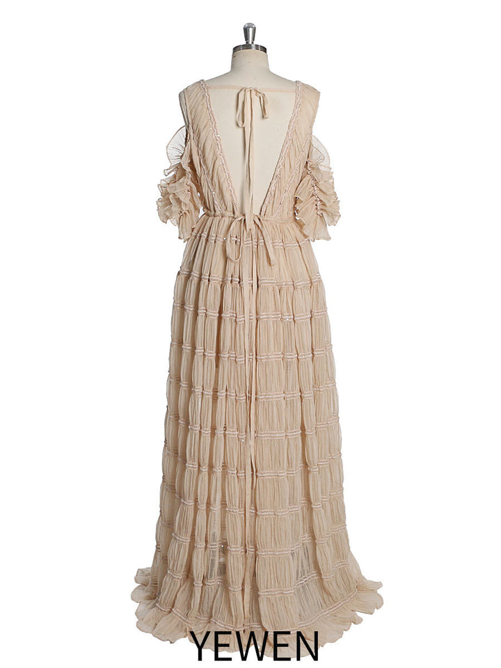 Back view of kahaki chiffon dress for photo shoot with adjustable shoulder and elegant flowing design