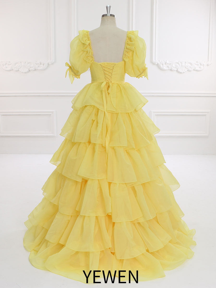 Back view of yellow fairy dress with layered ruffles designed for graduation parties and elegant events