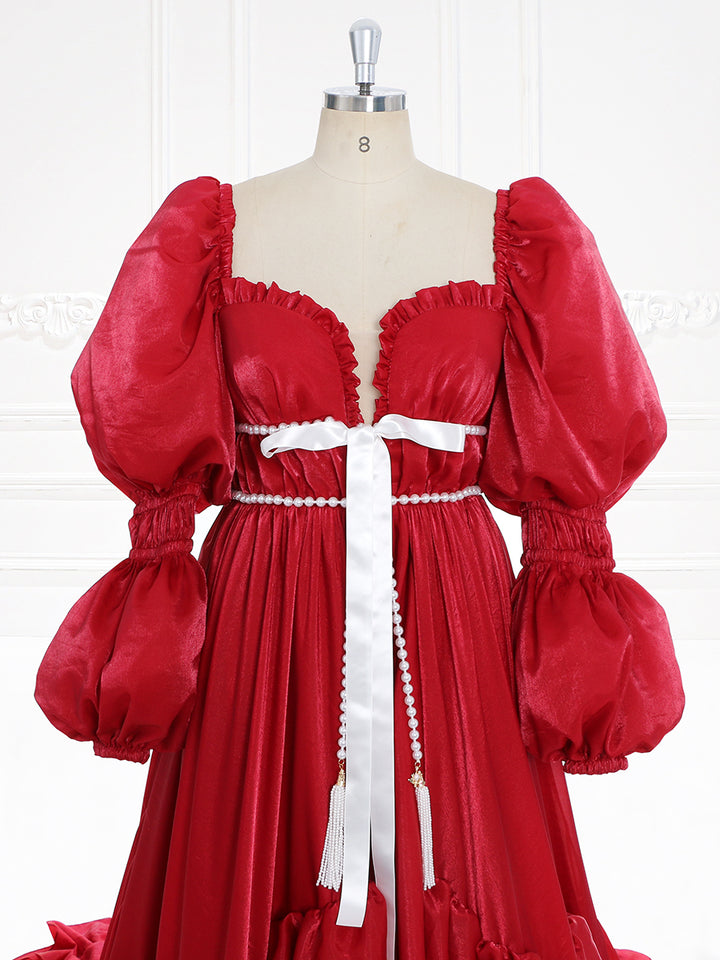 Close-up of fairy dress featuring a red elegant gown design for Christmas parties, photography, and formal events