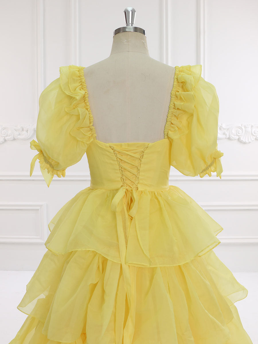 Back view of yellow fairy dress with layered ruffles designed for graduation parties and elegant events