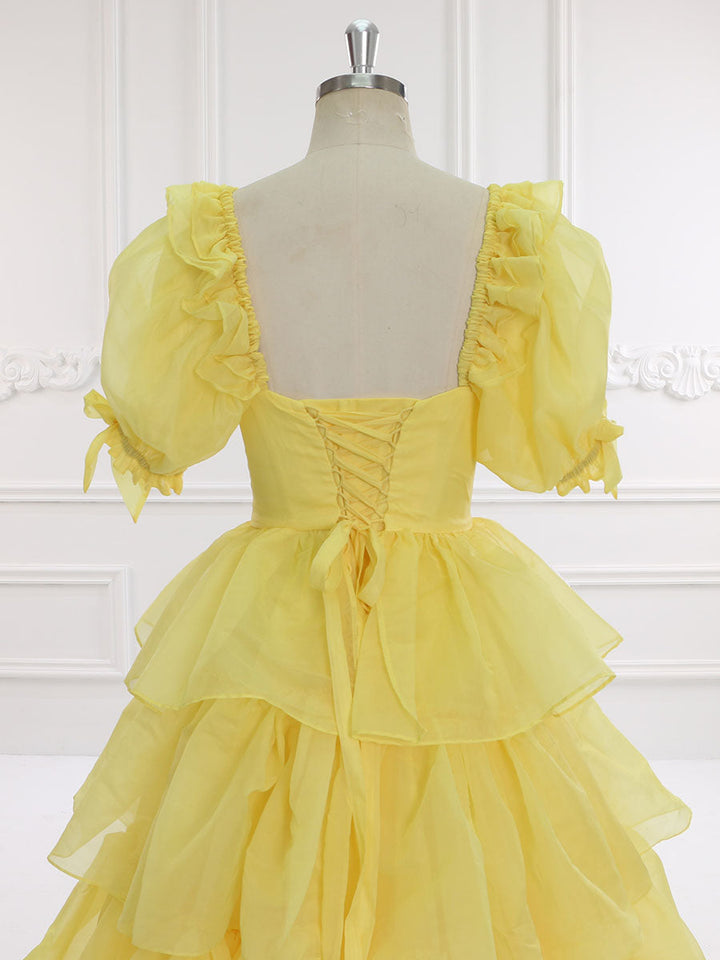 Back view of yellow fairy dress with layered ruffles designed for graduation parties and elegant events