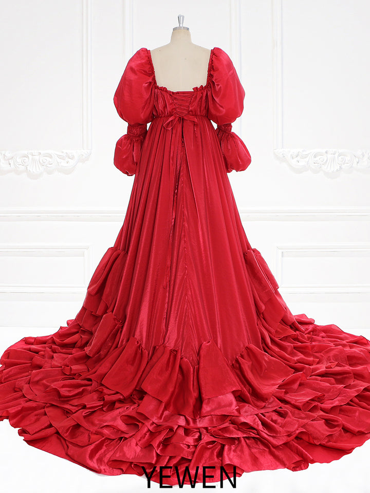 Close-up of red fairy dress skirt details showing elegant layers and romantic gown craftsmanship