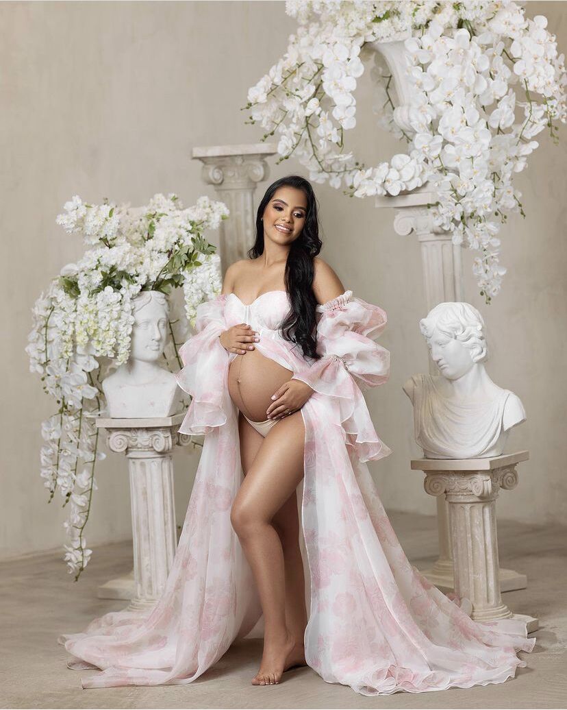 Front view of pink floral maternity dress for photoshoot with silk organza fabric and elegant flowing silhouette