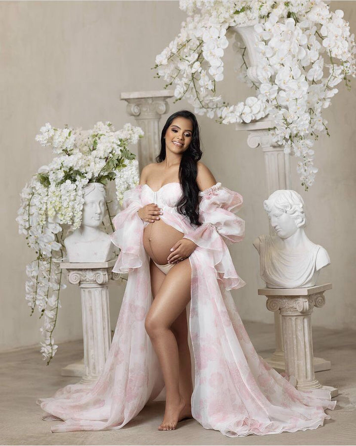 Front view of pink floral maternity dress for photoshoot with silk organza fabric and elegant flowing silhouette